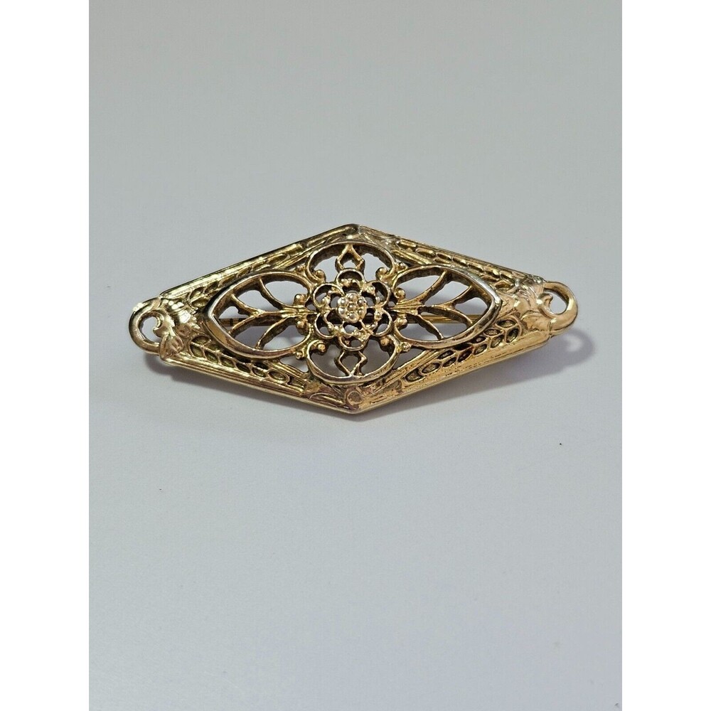 1928 brand gold tone brooch